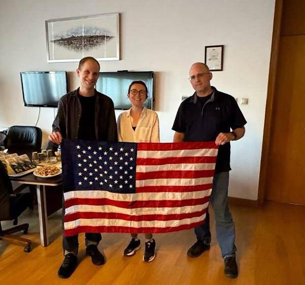 Evan Gershkovich, Alsu Kurmasheva, and Paul Whelan after being released in the priso<em></em>ner swap with Russia