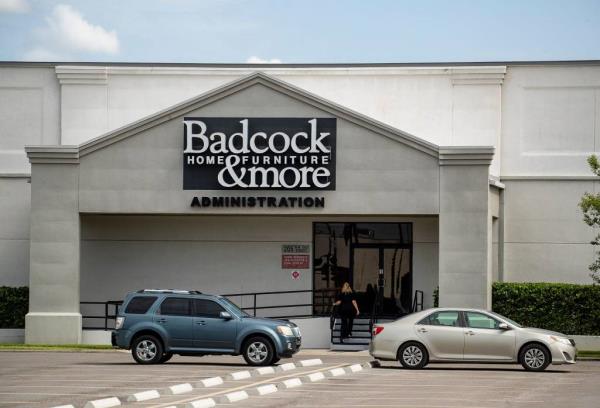 Cars parked outside the Badcock & More Home Furniture Administration Offices in Mulberry, Florida. On July 26.