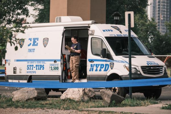 Police and EMS are seen at parking field 71 on Randall's Island in New York wher<em></em>e three people were shot, one fatally, on Monday, July 29, 2024.