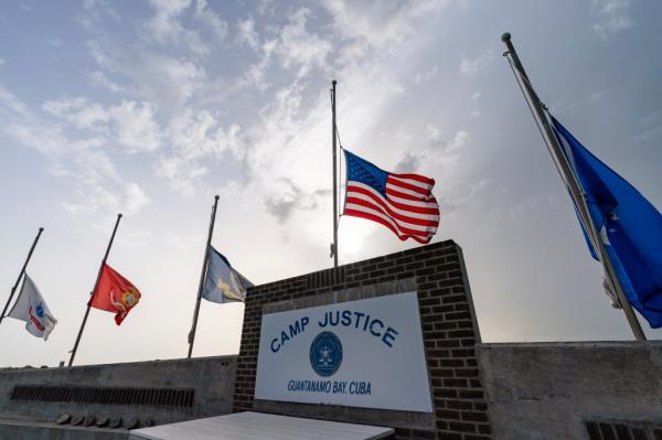 flags fly at half-staff at Camp Justice, Aug. 29, 2021, in Guantanamo Bay Naval ba<em></em>se, Cuba