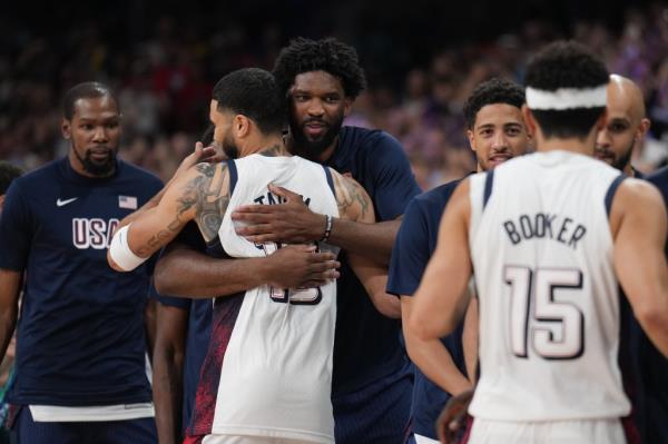 Jayson Tatum embraces Joel Embiid of the USA Men's Natio<em></em>nal Team hugs Jayson Tatum before the game on July 31, 2024.