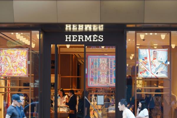 French luxury design house Hermès logo and store at Harbour City in Hong Kong.