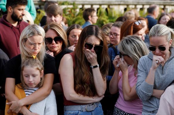 People attend a vigil for the victims of the knife attack in Southport on July 30, 2024.