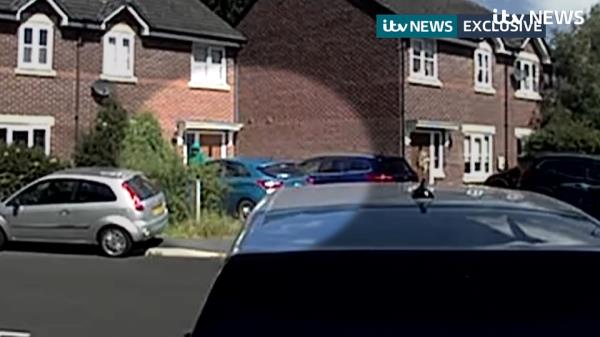 Footage captured a masked figure pacing outside a house that was raided in Southport after the knife attack.