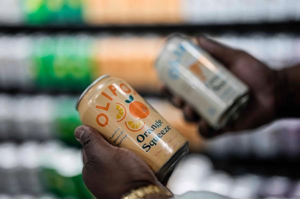 Cans of Olipop, a soda co<em></em>ntaining botanicals, plant fibers, and prebiotics, are shown at a Kroger supermarket, Friday, April 12, 2024, in Marietta, Ga.