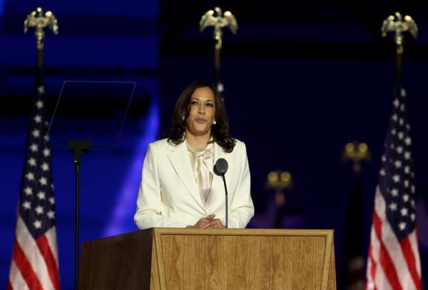 Kamala Harris at a podium talking. 