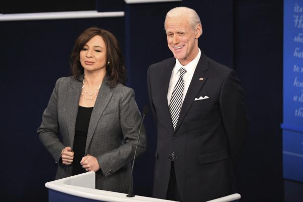 Maya Rudolph and Jim Carrey as Kamala Harris and Joe Biden on "SNL" standing next to each other smiling. 