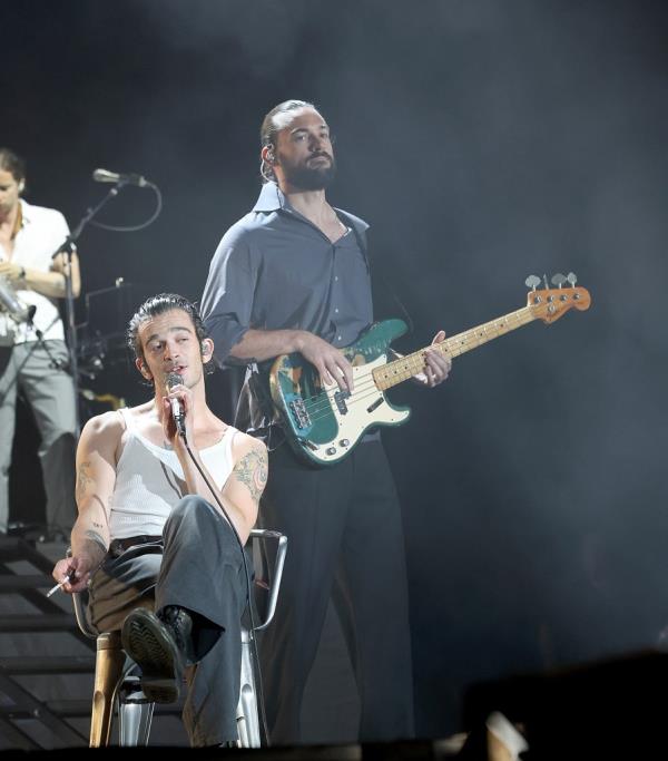 Matty Healy on a stage, his name trending on Twitter, alo<em></em>ngside an edited image wher<em></em>e his hat is placed on the map of Malaysia in a series of Instagram stories