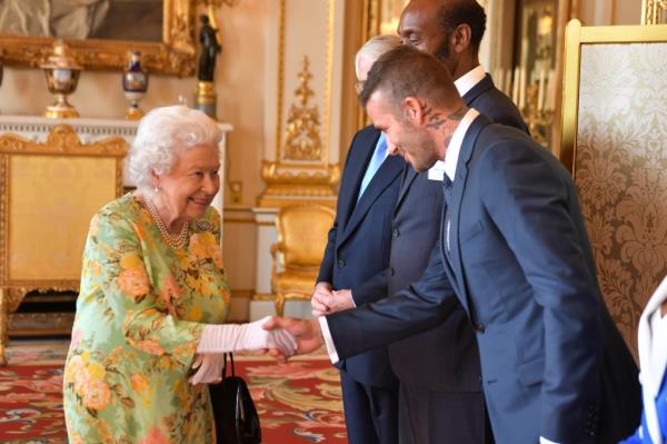 Queen Elizabeth II meets David Beckham at Buckingham Palace on June 26, 2018 in London, England