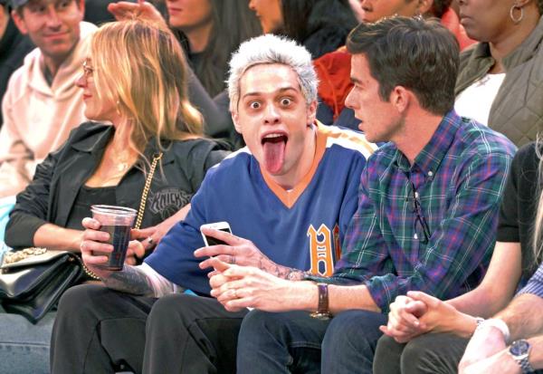 Pete Davidson sticks his to<em></em>ngue out at photographers as he sits court side during a New York Knicks game at Madison Square Garden on December 3, 2018.