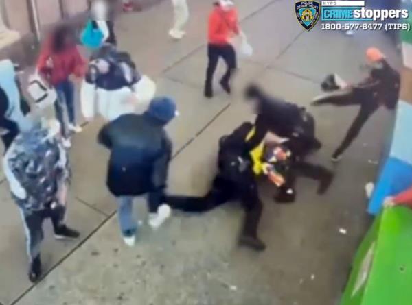 video captured the moment migrants pounded a pair of cops near Times Square