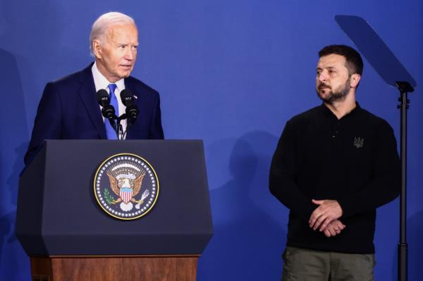 Biden and Ukraine President Volodymyr Zelenskyy attend the Ukraine Compact meeting during the 75th NATO Summit in the Walter E. Washington Co<em></em>nvention Center in Washington, DC, on July 11, 2024.