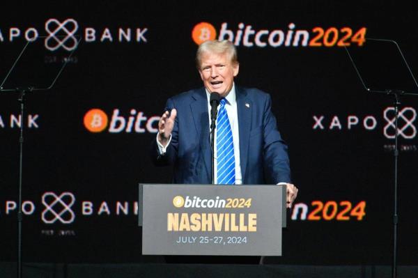 Trump speaking on stage at 2024 Bitcoin Conference.