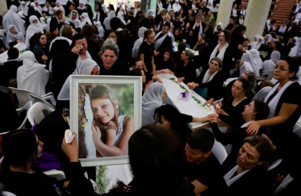 The funeral for children killed in the Hezbollah rocket attack was held in a Druze village in the Golan Heights.