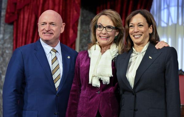 U.S. Senator Mark Kelly (D-AZ) poses with his wife and former U.S. Rep. Gabby Giffords and Vice President Kamala Harris.