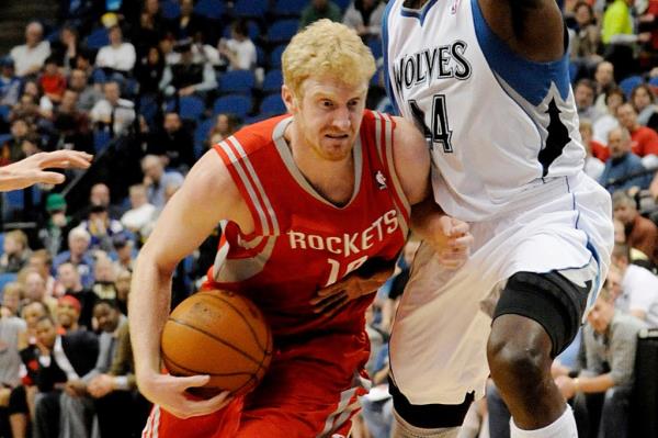  Former Houston Rockets' Chase Budinger, left, drives around Minnesota Timberwolves' Anthony Tolliver during the second half of an NBA basketball game on Wednesday, April 13, 2011.